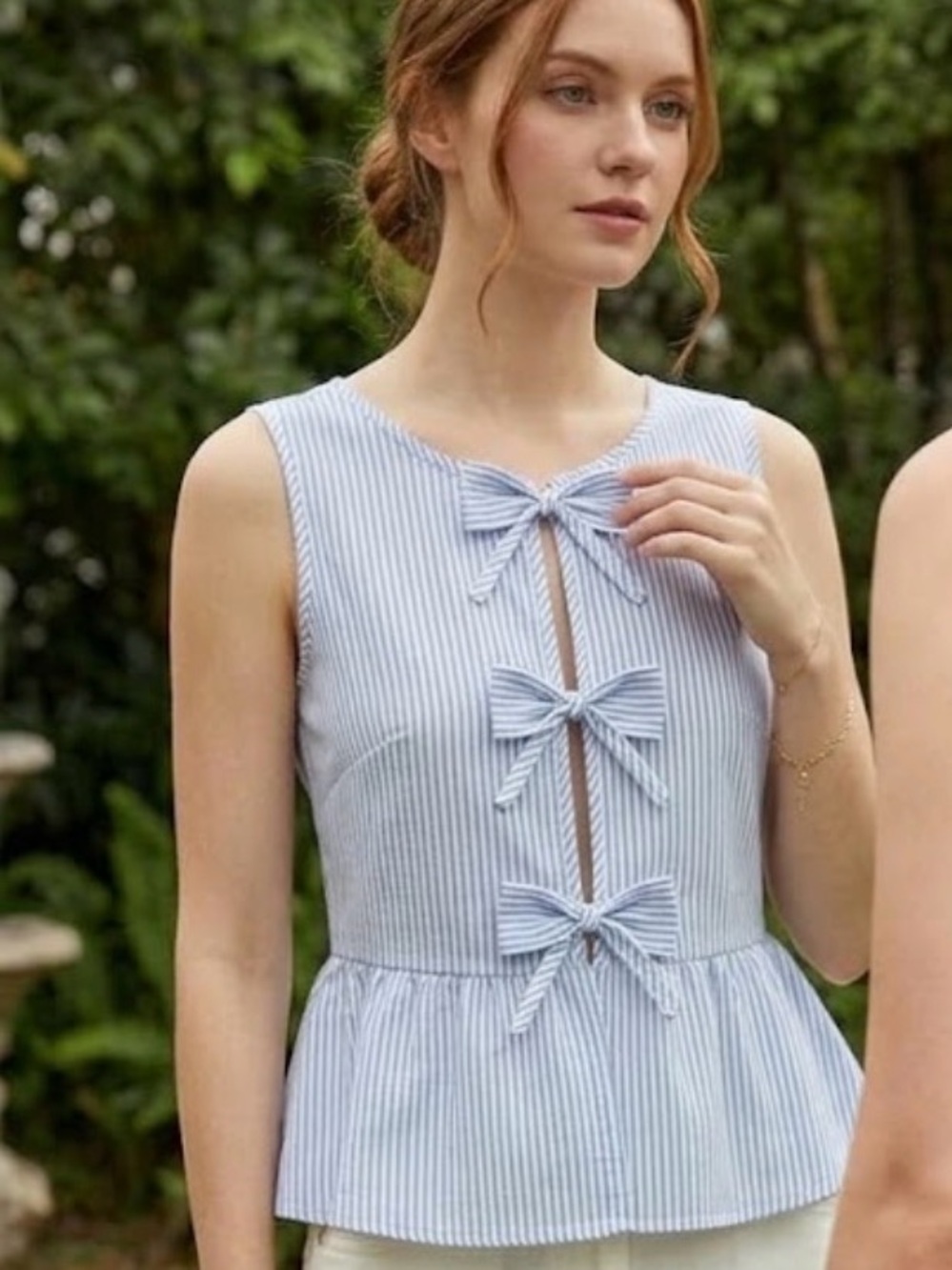 Sleeveless Blue and White Striped Tie-Front Peplum Top